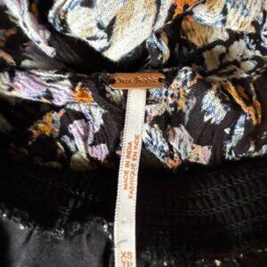 Free People mini dress. Soft slip underneath/background is black. XS.